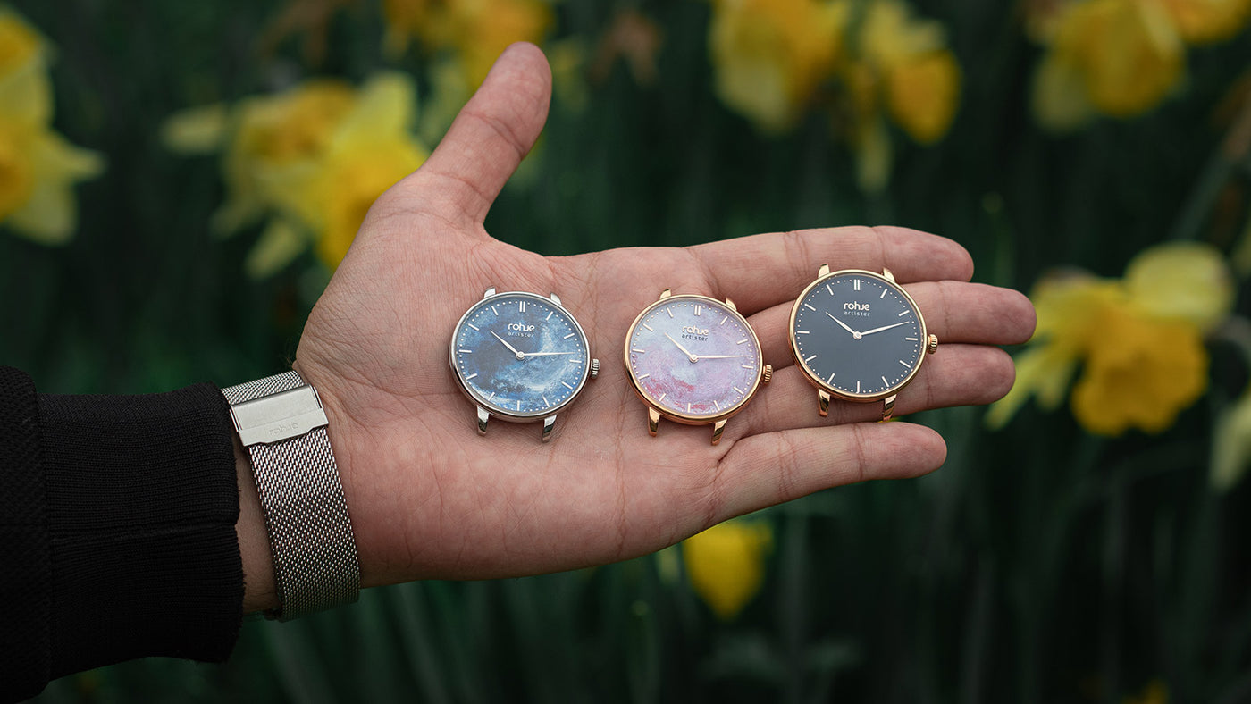 Hand holding artister collection watches